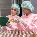 Two Indian factory workers